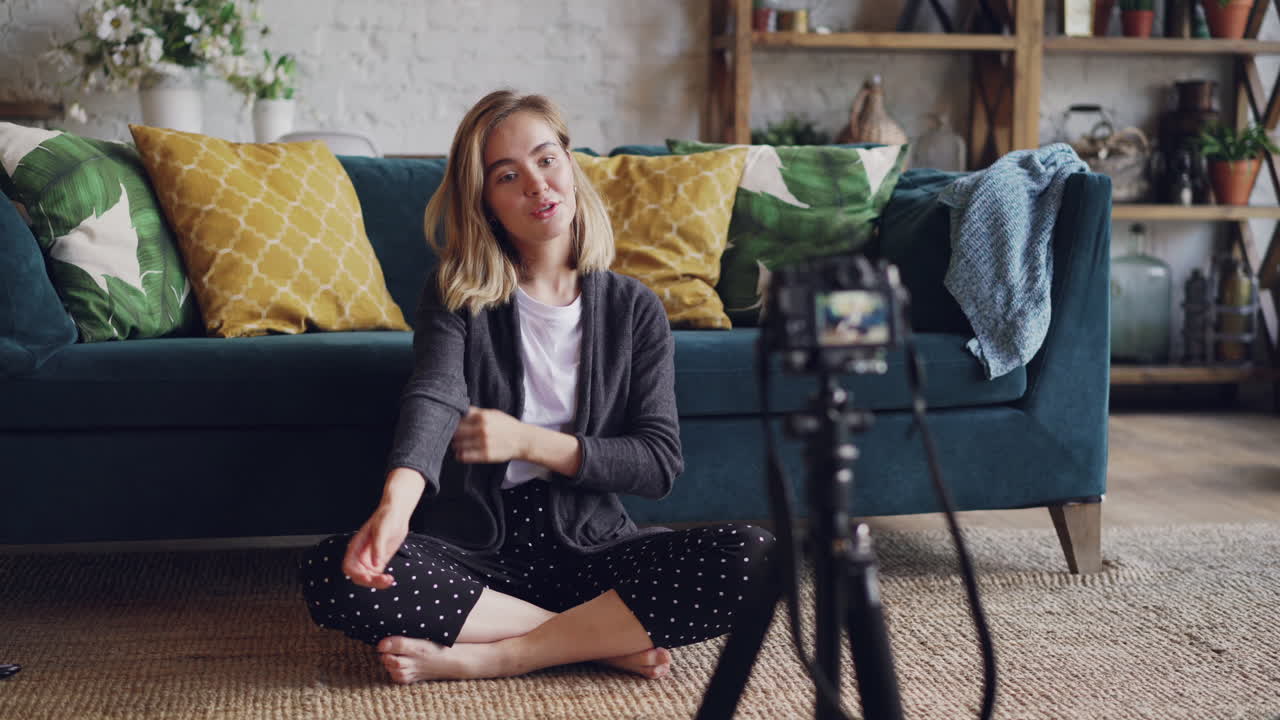 Woman vlogging in her living room