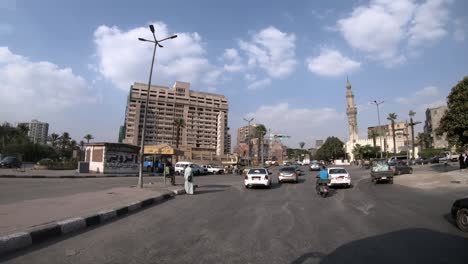 a street scene in cairo, traffic jam in the center of the city, driver pov