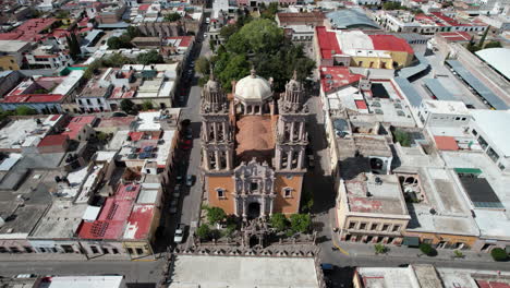 aerial drone footage moving towards the sanctuary in jerez, zacatecas, camera tilts down to a cenital view as it approaches