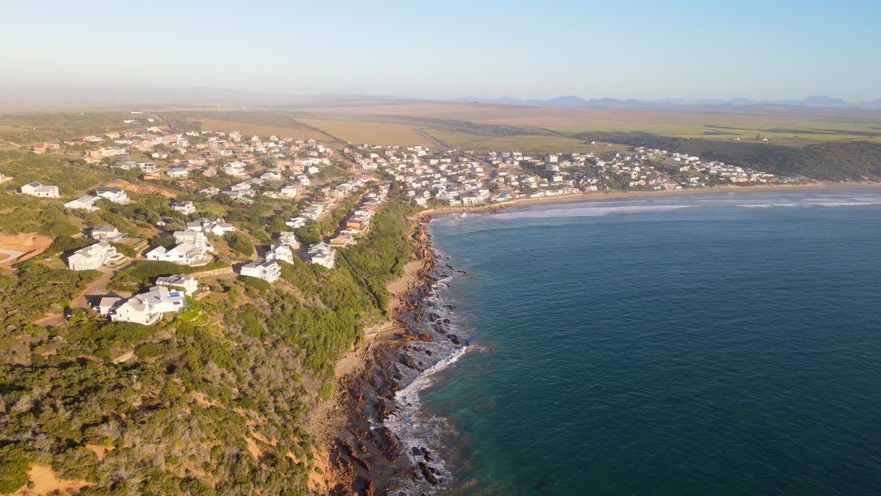Hillside properties of Vleesbaai overlooking Indian ocean, sunrise aerial