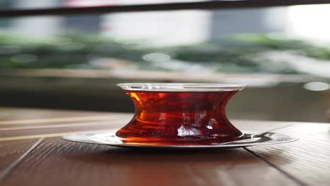 a closeup of a glass of turkish tea