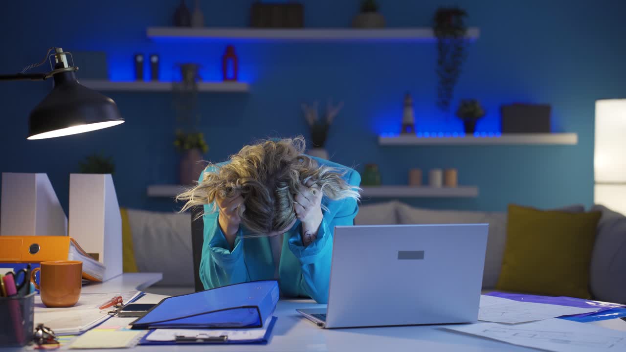 Home office worker woman looking at the file angrily.