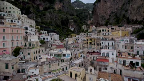 historically rich town on italy's scenic amalfi coast with towering rocky cliffs in background