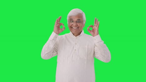 Happy-Indian-old-man-showing-okay-sign-Green-screen