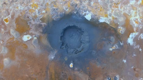 Top-down-aerial-view-of-a-thermal-mud-spring-boiling-in-Iceland