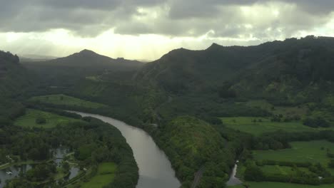 4k aerial drone shot over the river valley in kauai, hawaii