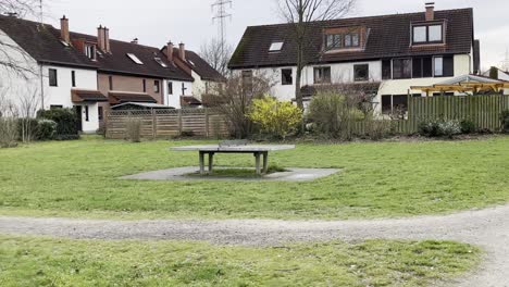 table tennis table on a meadow in a housing estate