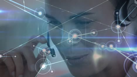 Animation-of-network-of-connections-over-businesswoman-wearing-phone-headset