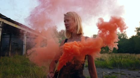 buttery soft slow motion cinematic shot witch with orange smoking wandcolorful fog shooting russians airplane hangar gimbal foto video shoot on lost places in wild nature 1080, 24p by philipp marnitz