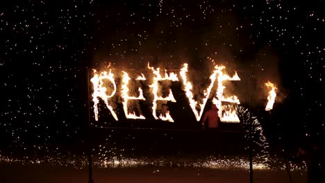 fire show spelling 'reeve' at night