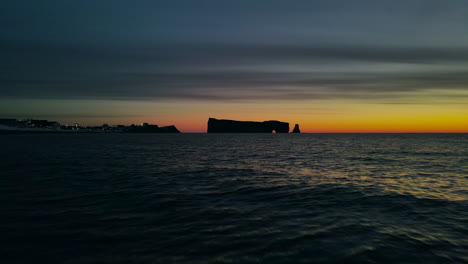 drone view at sunrise of famous perce rock in percé, québec, canada