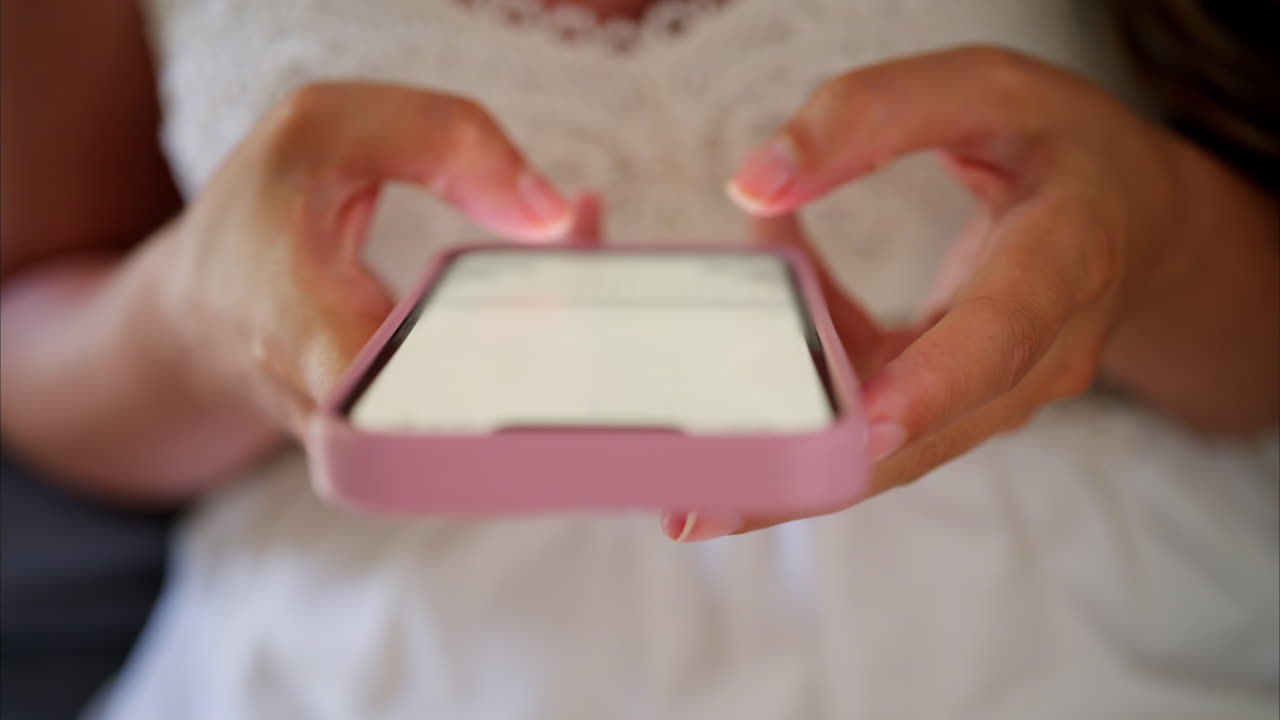 Close up of a woman scrolling on her phone