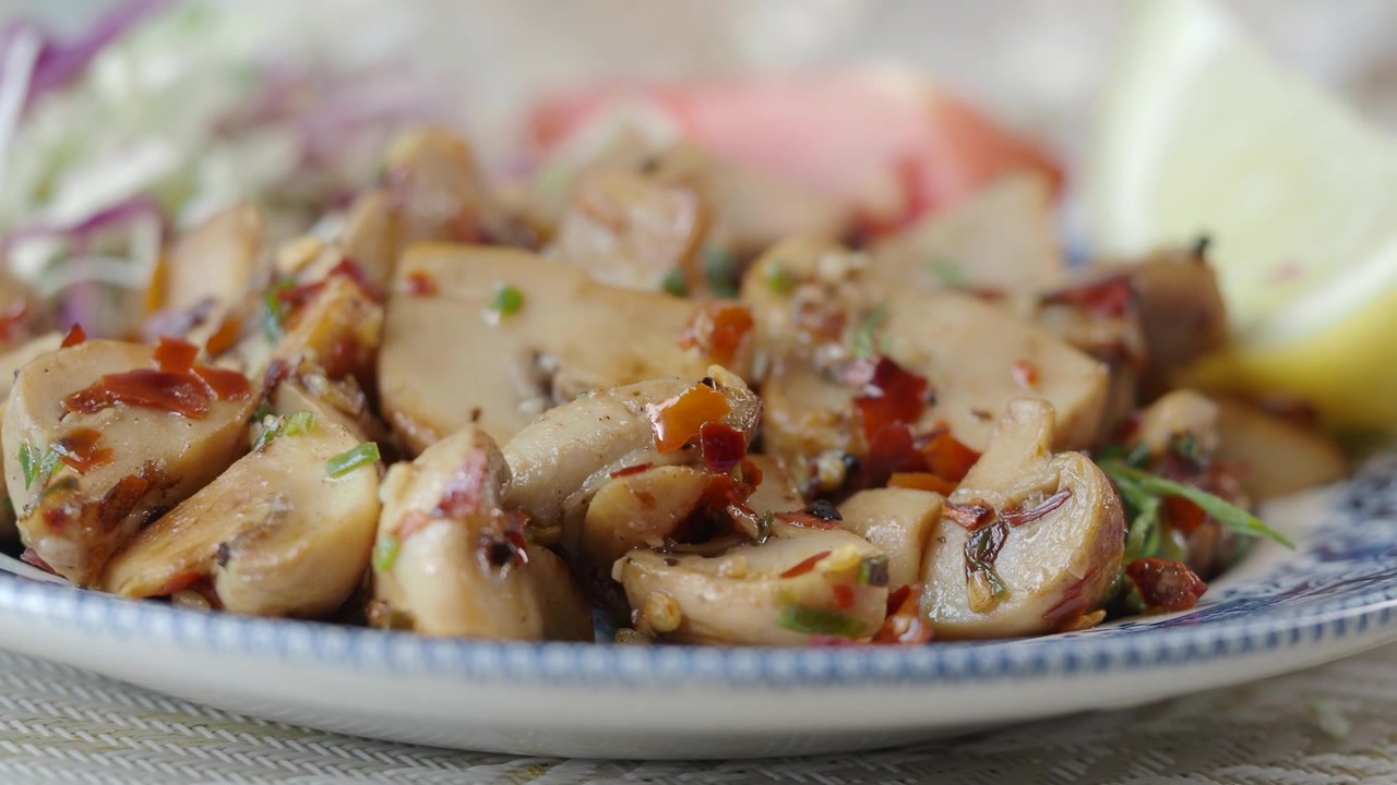 Close-up of Sautéed Mushrooms Seasoned with Herbs and Chili