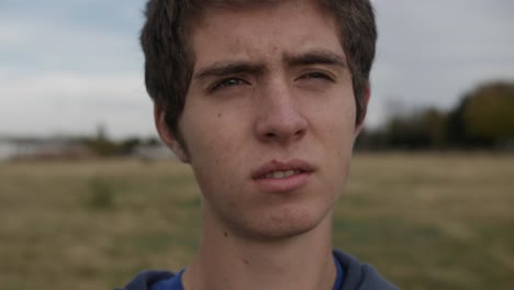 slow motion, 60 fps closeup of a young teen boys face