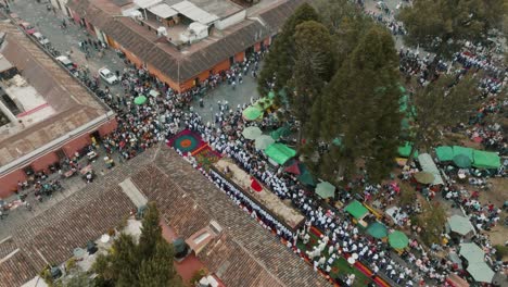 Catholic-People-Marching-With-Andas-Processional-Float-During-Semana-Santa-In-Antigua,-Guatemala