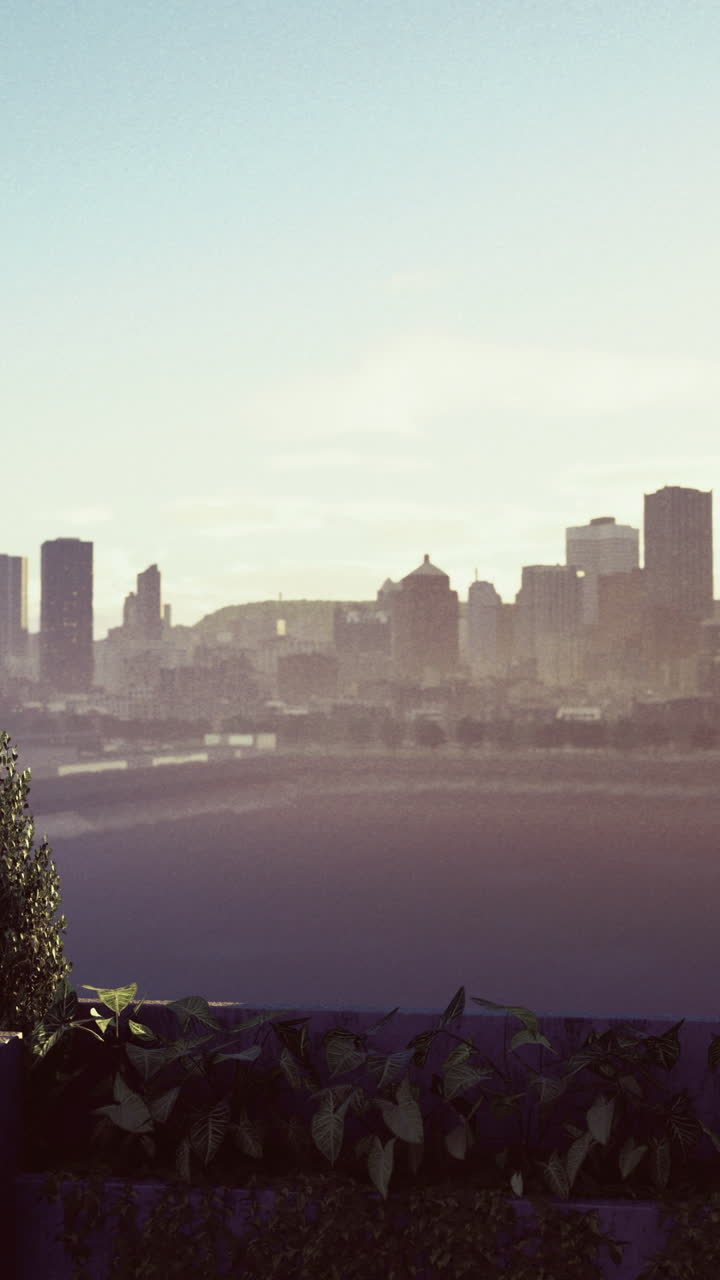 Modern city skyline at sunset viewed from a contemporary balcony space