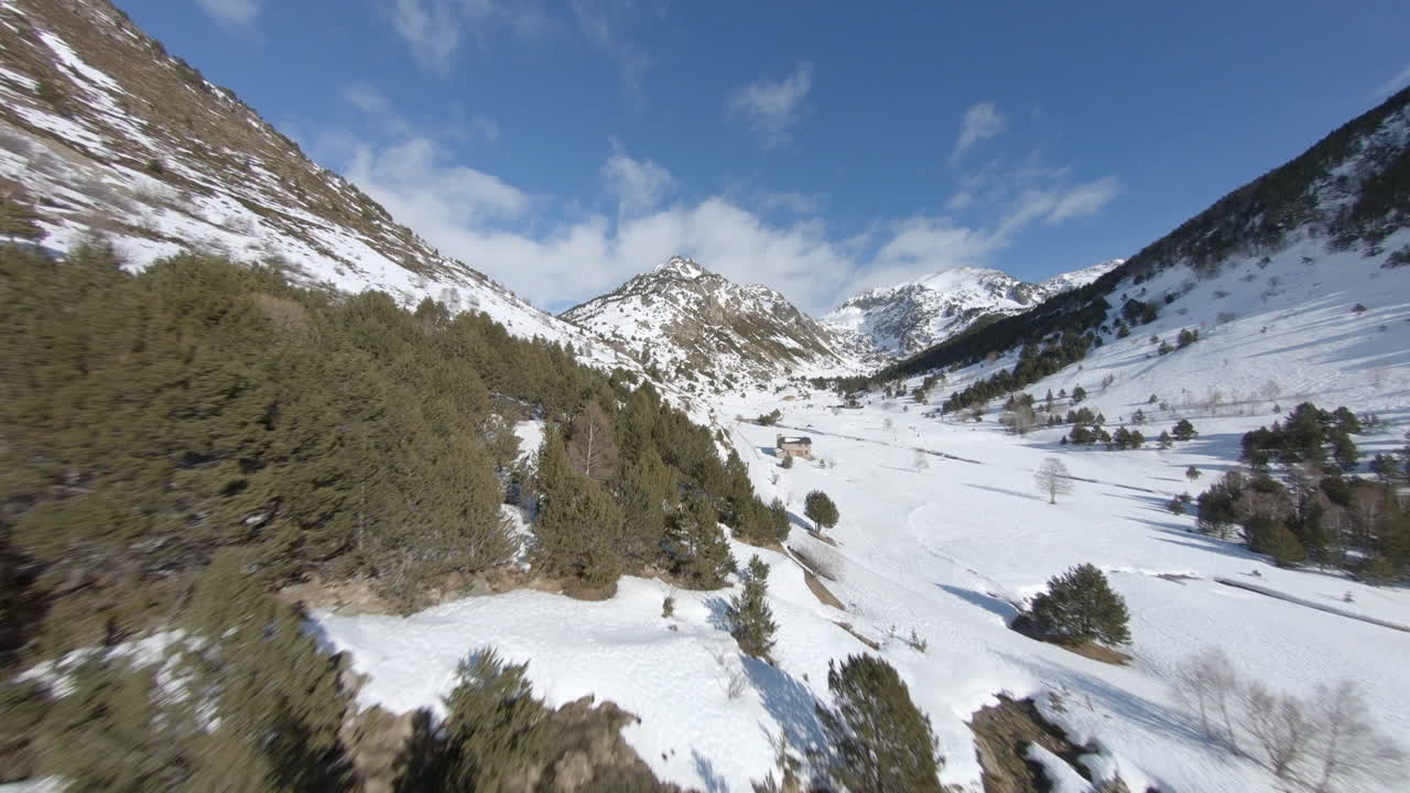 Drone flying over snowcapped landscape of Pyrenees mountains