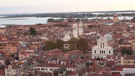 the historic rooftops of venice, italy, at sunset offer a serene view of ancient architecture
