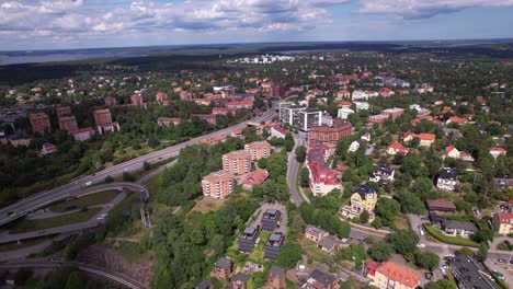 Aerial View of a Suburban Cityscape with Residential Buildings and Green Landscape