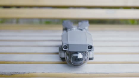 drone on a wooden bench