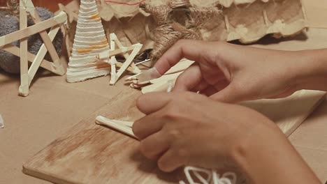 making christmas decorations with wooden sticks