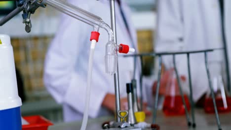attentive school kids doing a chemical experiment in laboratory
