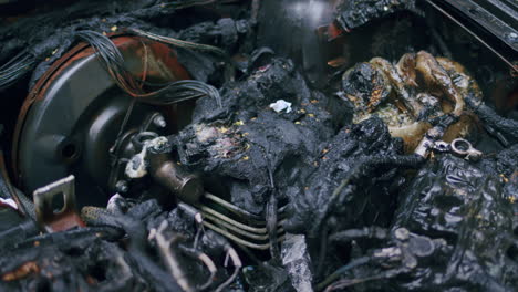 deteriorating and rusty burnt car engine interior