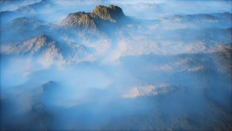 distant mountain range and thin layer of fog on the valleys