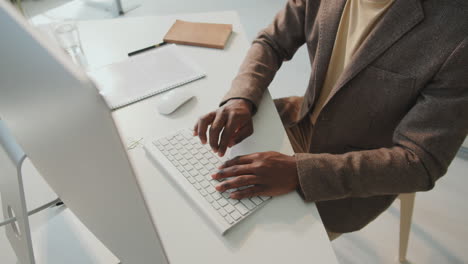 unrecognizable man working in office