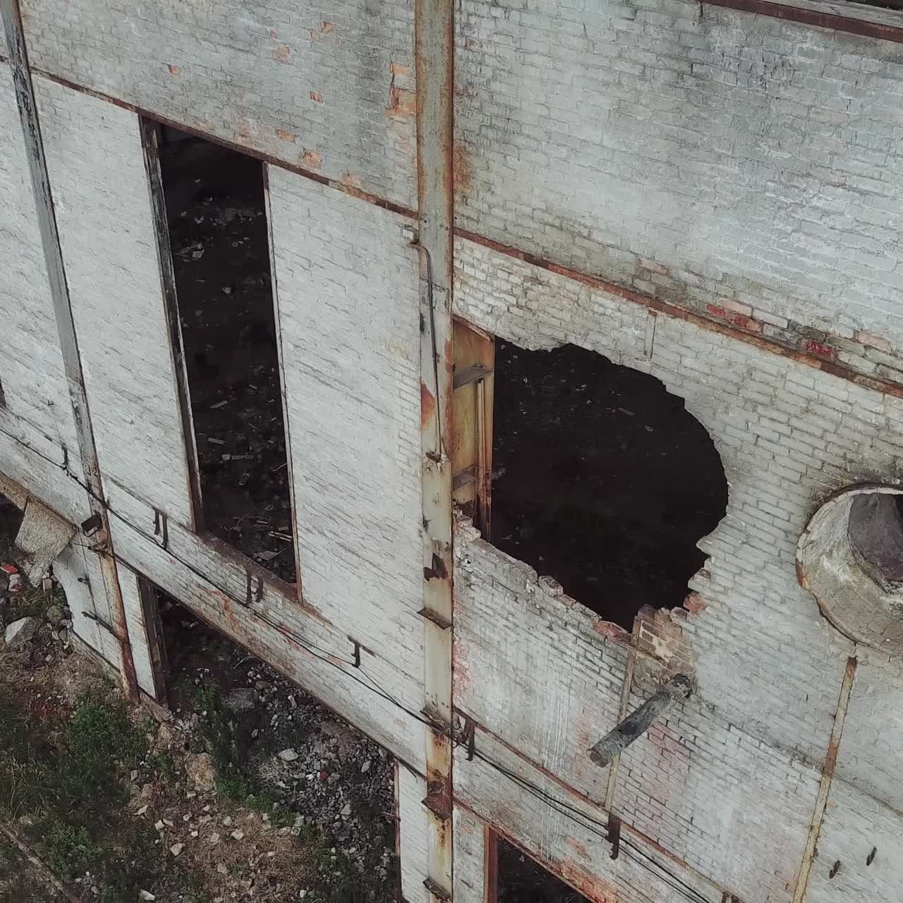 Aerial view of a destroyed factory during the war. Abandoned industrial building.
