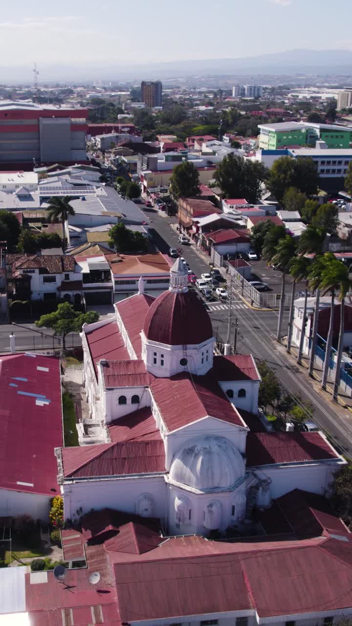 An aerial perspective of Santa Teresita Church in San Jose, in Costa Rica. Vertical Video