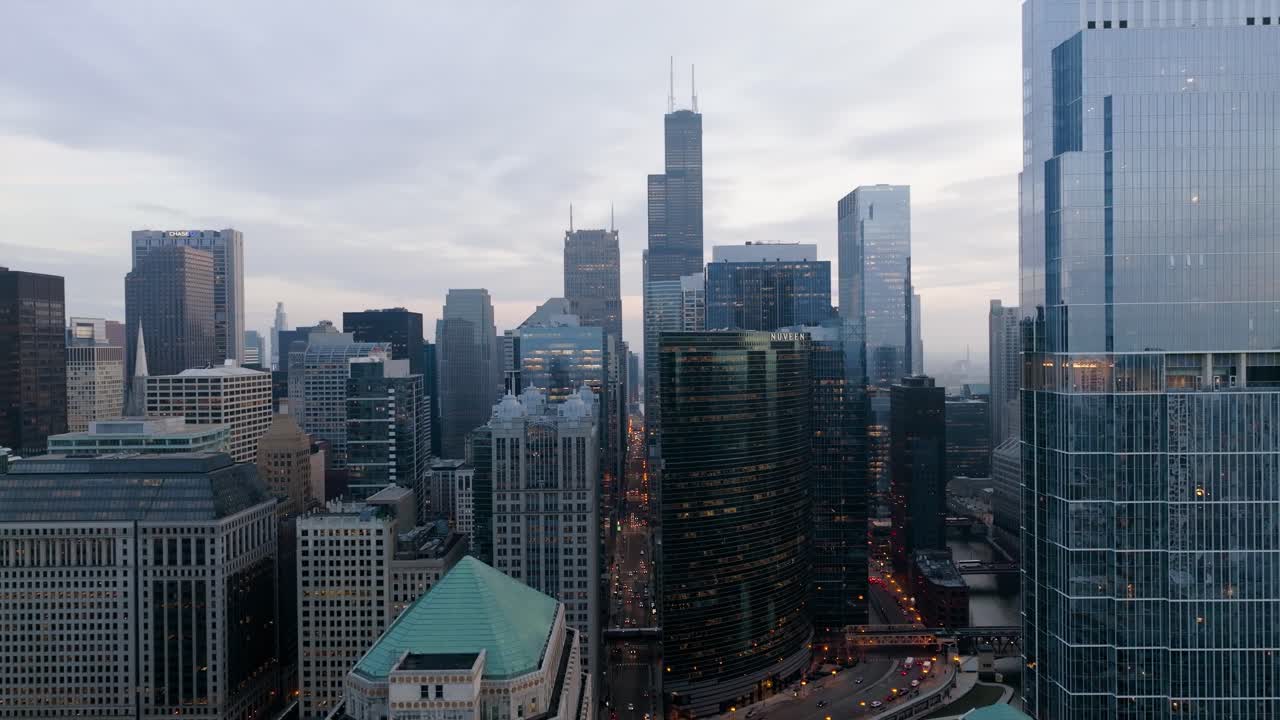 Aerial view over the Wolf Point West, towards the Franklin Street, cloudy evening in Chicago, USA