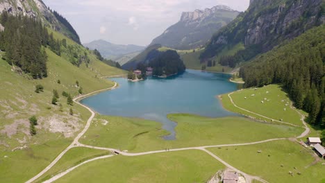 a drone flying above a mountain lake in switzerland