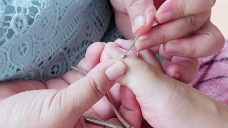 cosmetologist beautician is making pedicures in cosmetology clinic using nippers-5