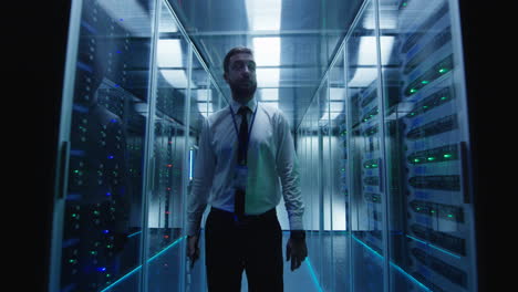it professional walking through a modern server room