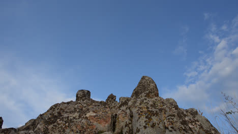 Camera-pans-down-from-the-sky-on-the-rocks-of-the-Megalithic-Observatory-in-Staro-Nagorichane,-Macedonia