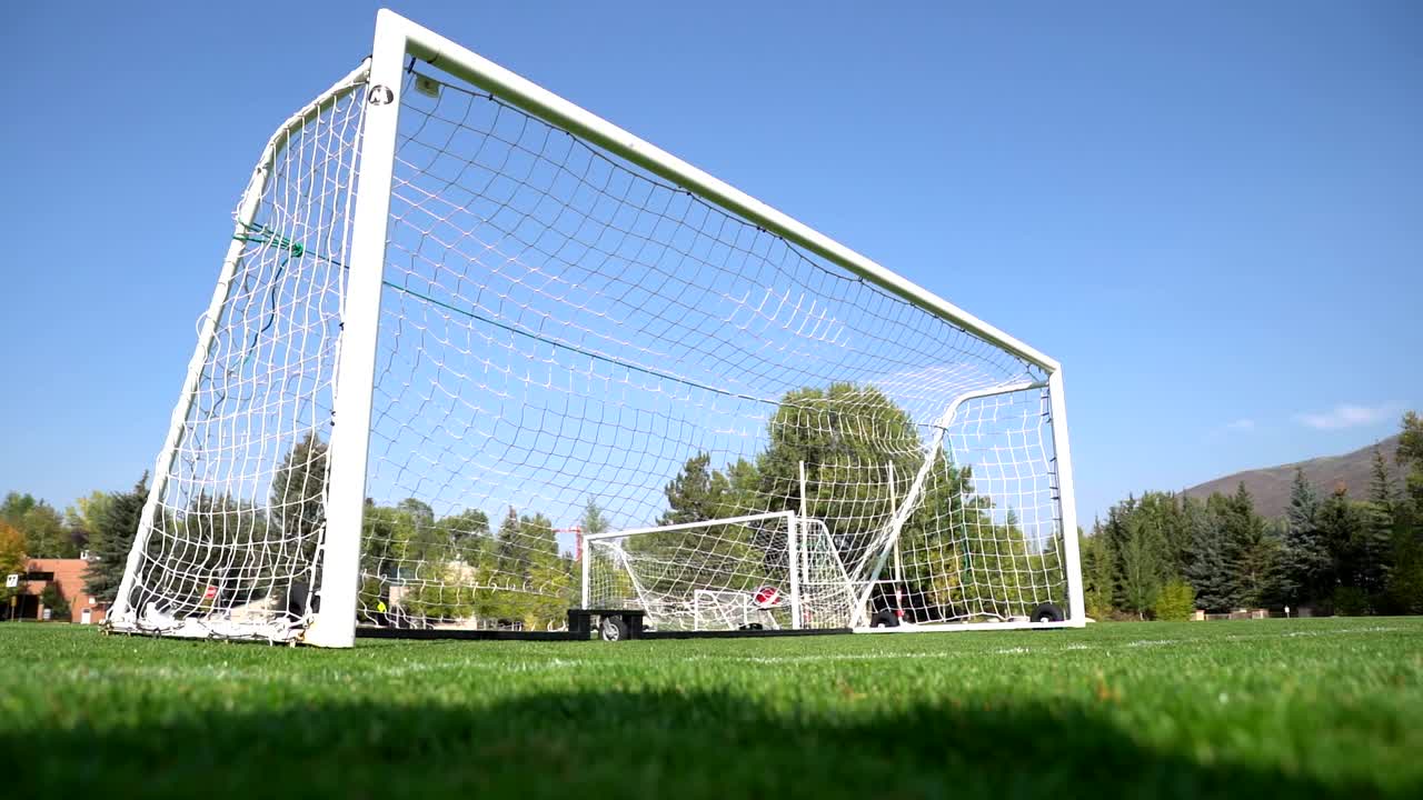 Soccer ball hitting the net in slow motion