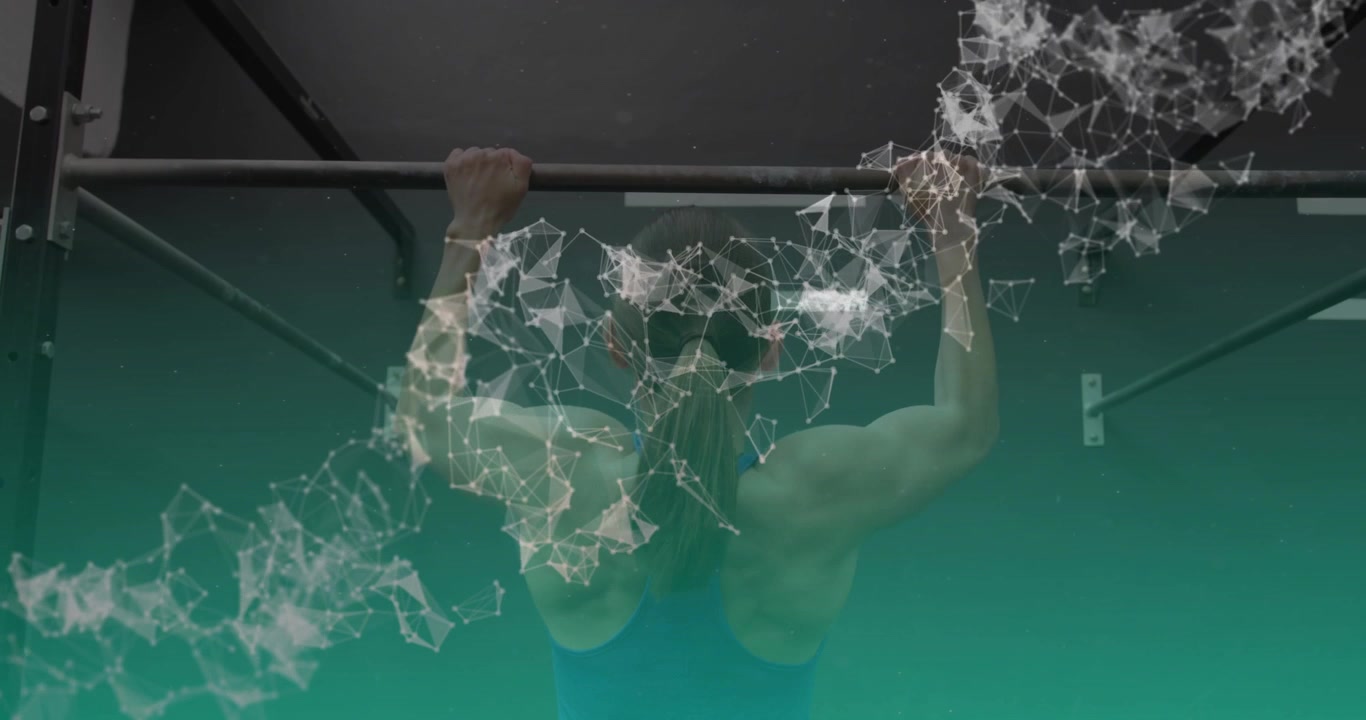 Woman gripping pull-up bar and pulling in gym, particle overlay tracking back muscle for strength