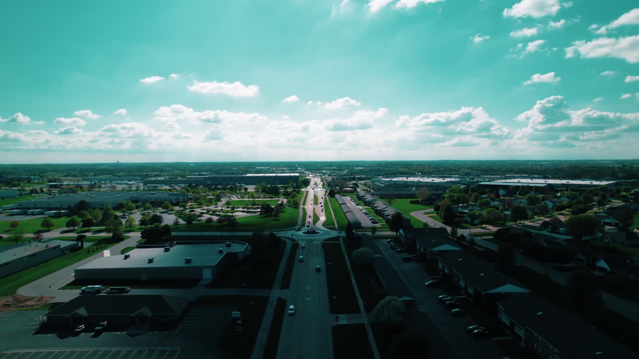 De Pere's iconic water tower amid lush greenery, serene neighborhoods, and clear skies in Wisconsin.