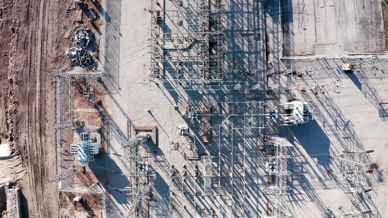 Drone shot of electrical grid transmission cables and power lines