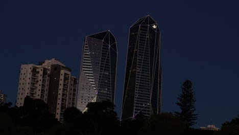 skyscrapers illuminated against the night sky