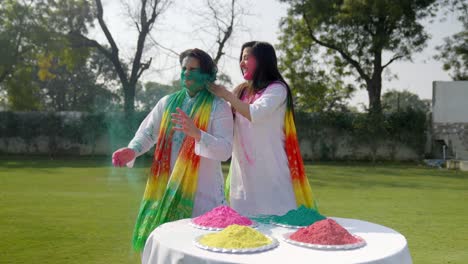 indian couple enjoying holi party