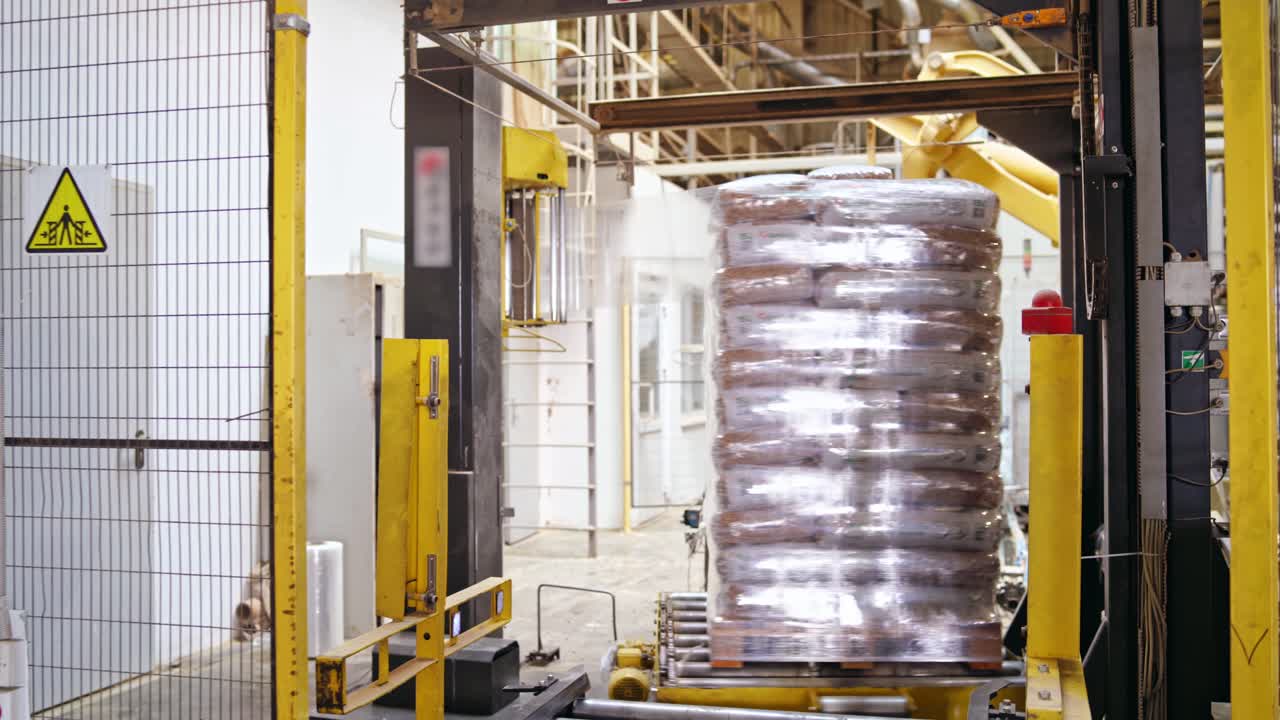 Shipping boxes wrapped in plastic shrink. Goods on a wooden pallet.