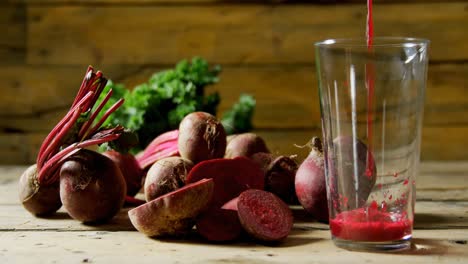 Radish-with-radish-juice-pouring-into-glass-4k