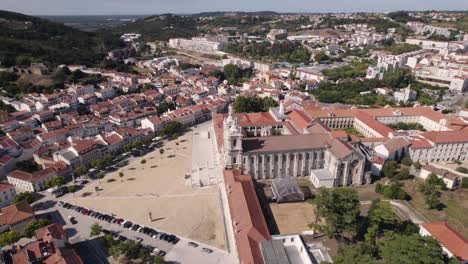 profile view of historic landmark alcobaça monastery complex against cityscape, portugal