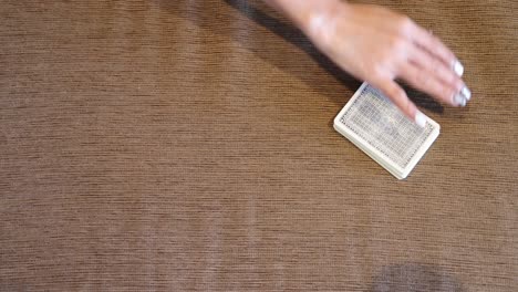 hands skillfully shuffling a deck of cards