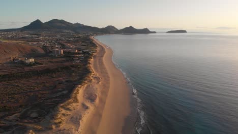 aerial panoramic view of matadouro beach in portugal at sunset