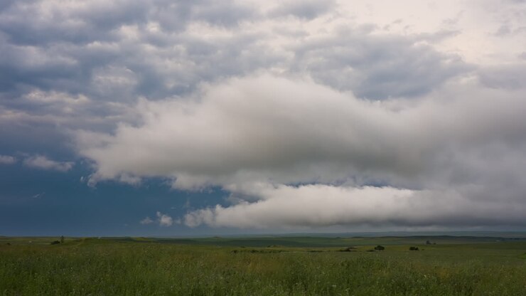 White Clouds Rolling Across Green Country Side