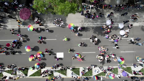 aerial drone shot of many people waving the pride flag in pride parade reforma avenue, mexico city