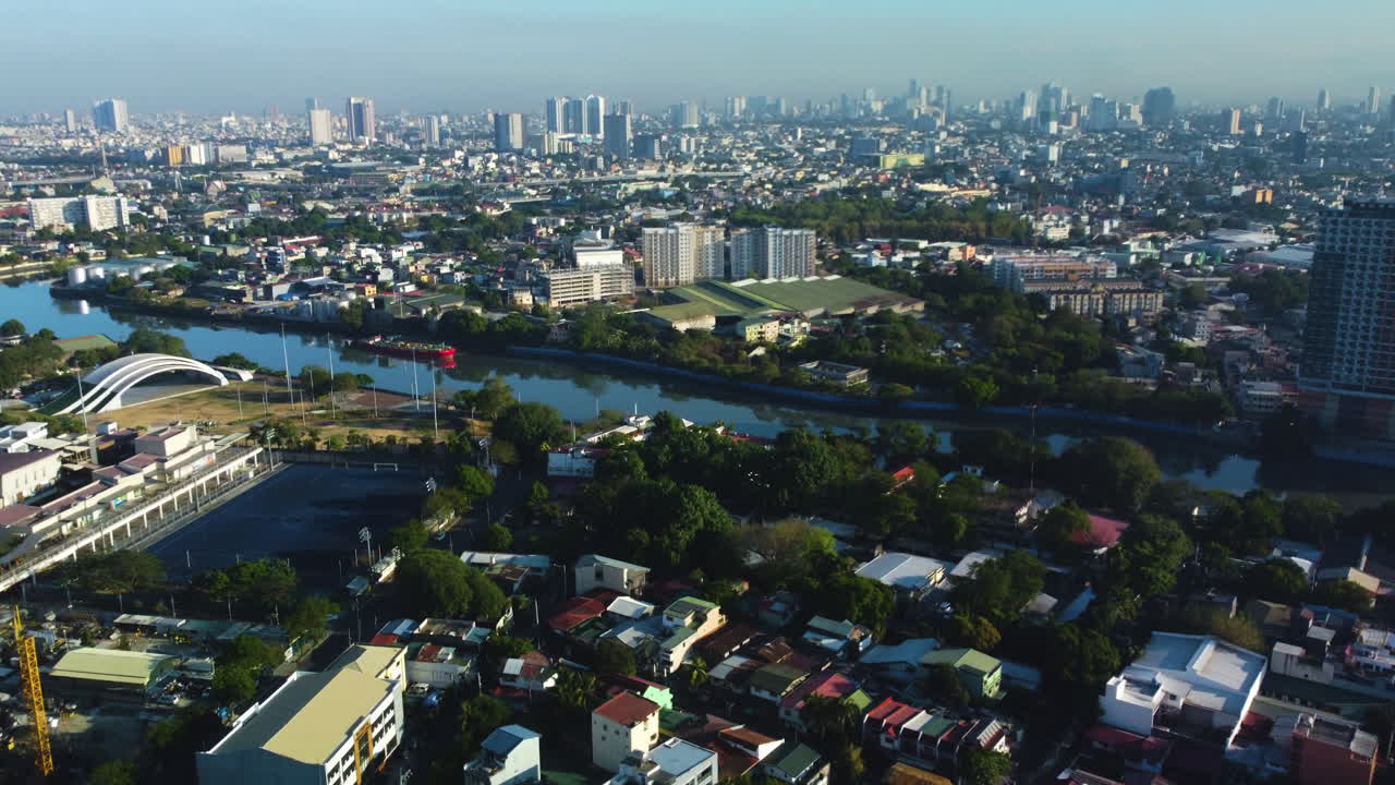 Aerial view over Makati, toward the Mandaluyong cityscape, in Manila, Philippines